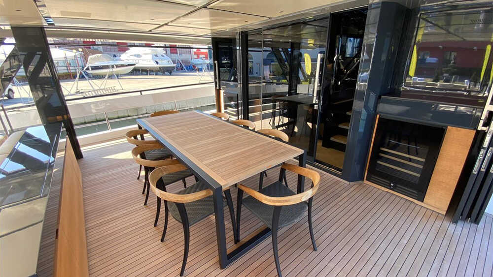 Dining area on main deck with sliding doors on sides