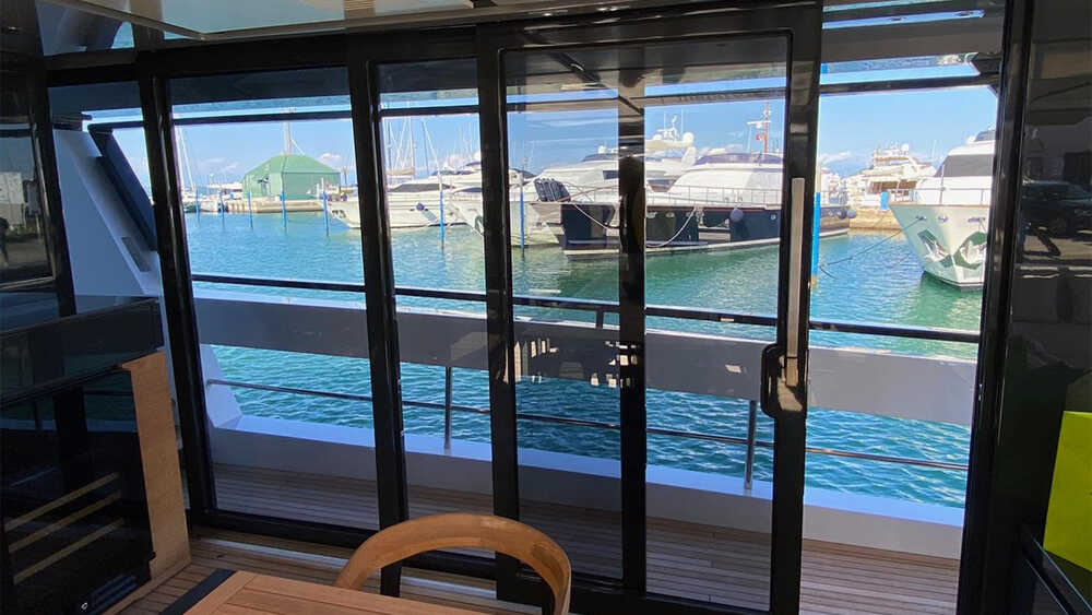 Dining area on main deck with sliding doors on sides