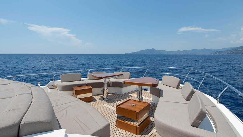 Lounge area with sunbathing cushions on bow