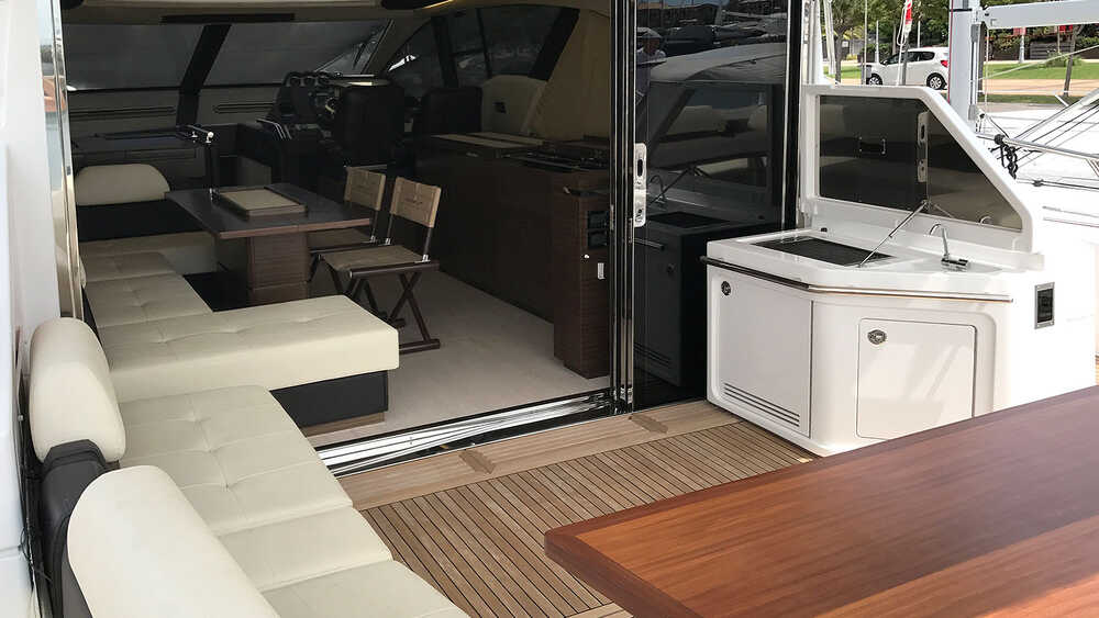Cockpit cabinet with BBQ, refrigerator and trash compartment