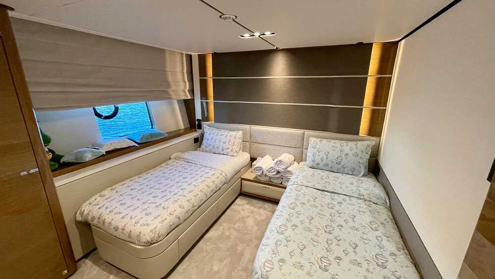 Guest cabin with two single beds on the port side