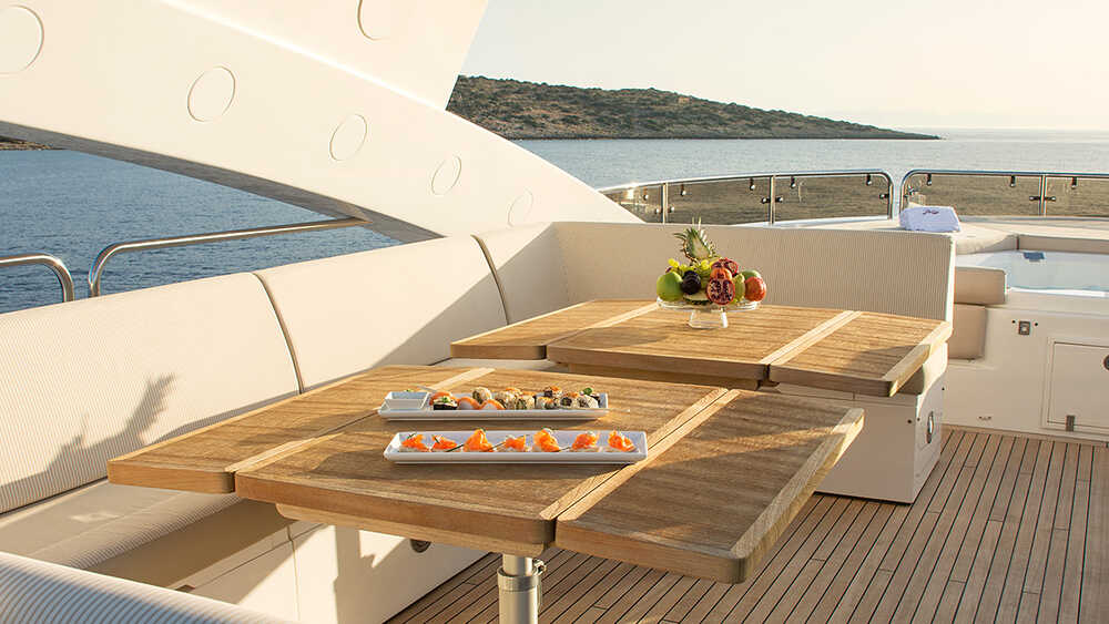 Seating area on port side with fixed dining table on Sky deck