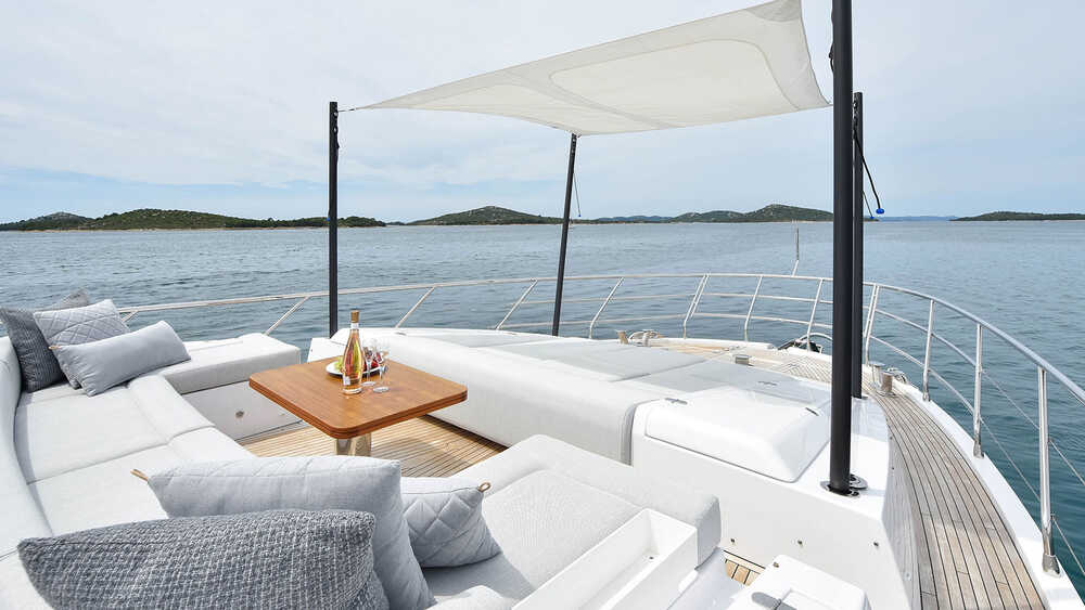Seating area and sunbathing cushions on bow