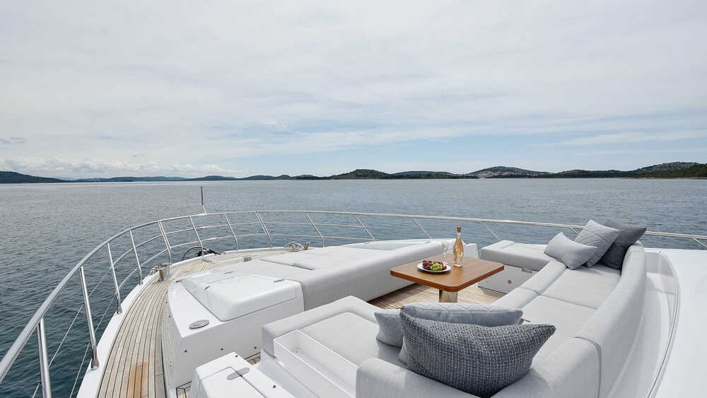 Seating area and sunbathing cushions on bow