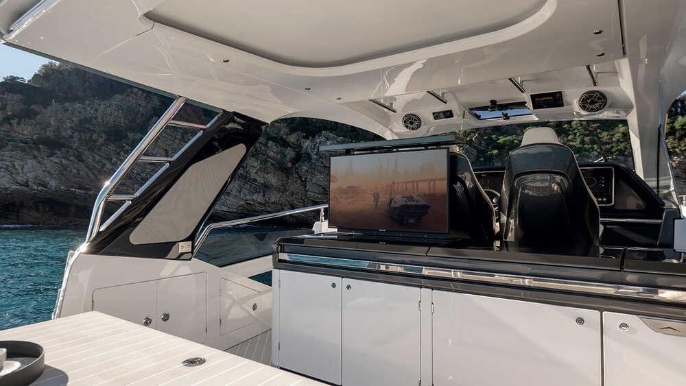 Wet bar on aft of the wheelhouse with ice maker and fridge