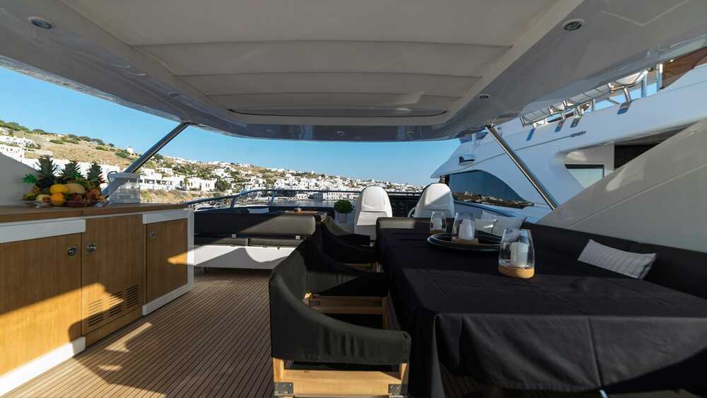 Dining area with wet bar on flybridge